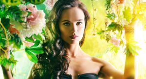 Brunette woman surrounded by plants with perfect skin after IPL photo facial.